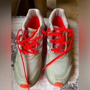 Adidas sneakers, sized 7.5. Gray with orange accents and laces.